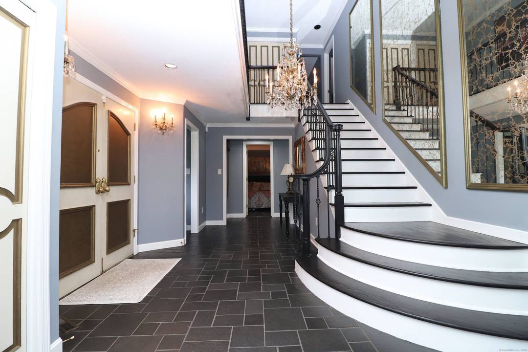 Discover a truly exceptional residence where classic Colonial charm seamlessly blends with the allure of the Mediterranean.