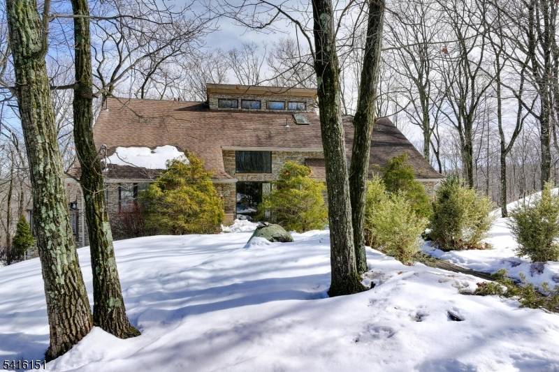 Enjoy breathtaking mountain and sunset views from the wraparound deck of this spacious custom built Colonial located in the beautiful gated community of Smoke Rise.