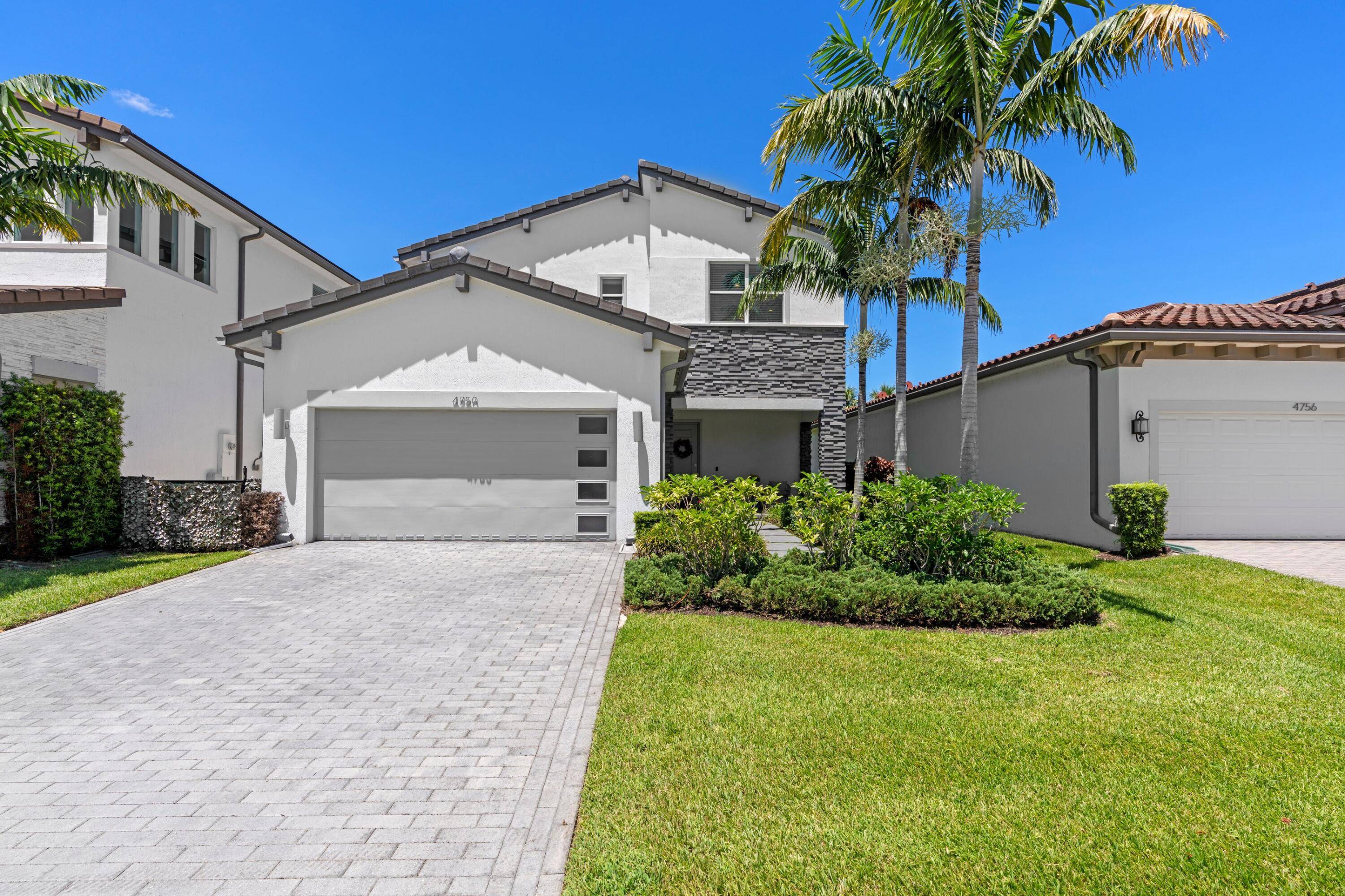 Built in 2019, this two story home blends modern style with lasting quality, featuring full impact windows and doors.