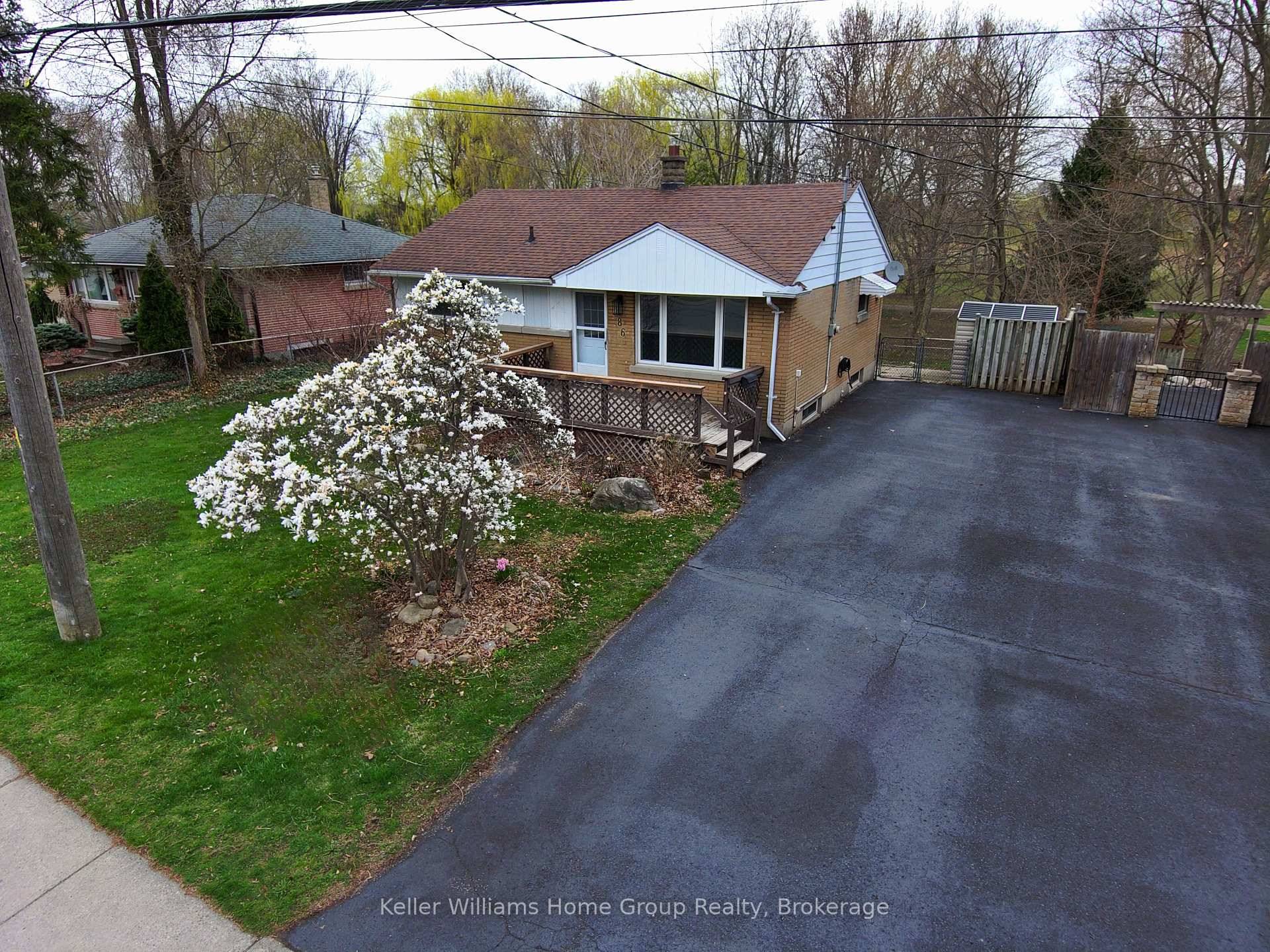 Welcome to 286 Brompton Ave, Woodstock a beautifully updated 3 1 bedroom, 2 full bathroom brick bungalow nestled in a desirable, family friendly neighborhood.