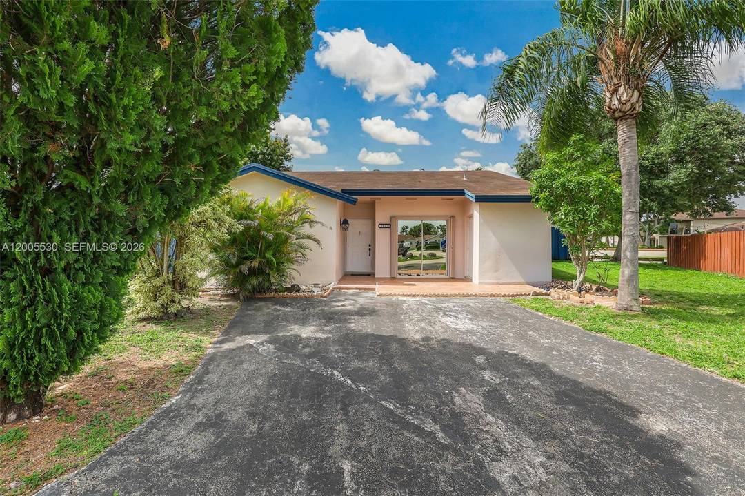 The split floor plan offers privacy and comfort, featuring a completely remodeled kitchen with modern finishes, sleek cabinetry, and updated appliances.