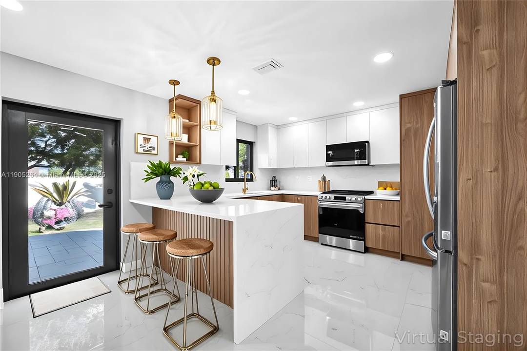 Imagine Sunday mornings in your stunning new kitchen, custom cabinets gleaming as sunlight streams through impact windows onto luxurious porcelain floors.