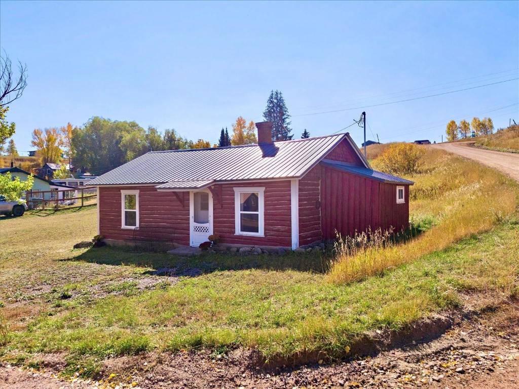 Located in the vibrant mountain town of Oak Creek, this historic log home offers rustic charm on over a quarter acre of land.