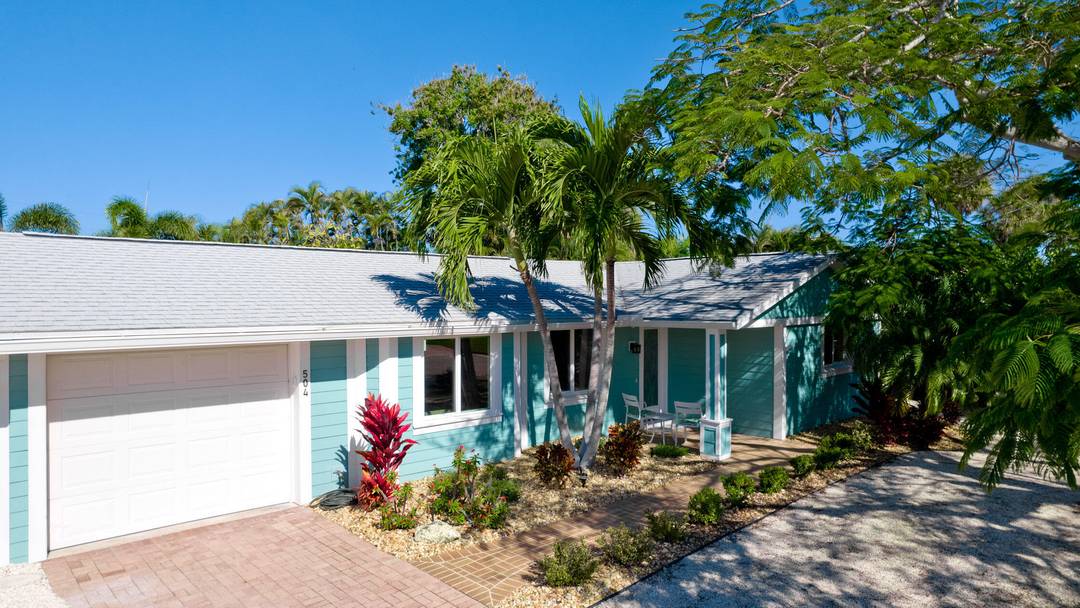 This newly and fully remodeled open floor plan 3 bedroom, 2 bathroom Holmes Beach, FL home is now offered WITH DEEDED BOAT SLIP AND BOAT LIFT as a move in ...