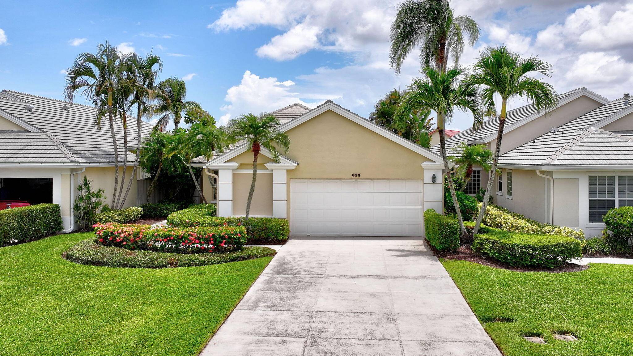 3 bedroom 3 bath with 2 car garage lake front golf home in gated Masters At Eagleton section of PGA National.