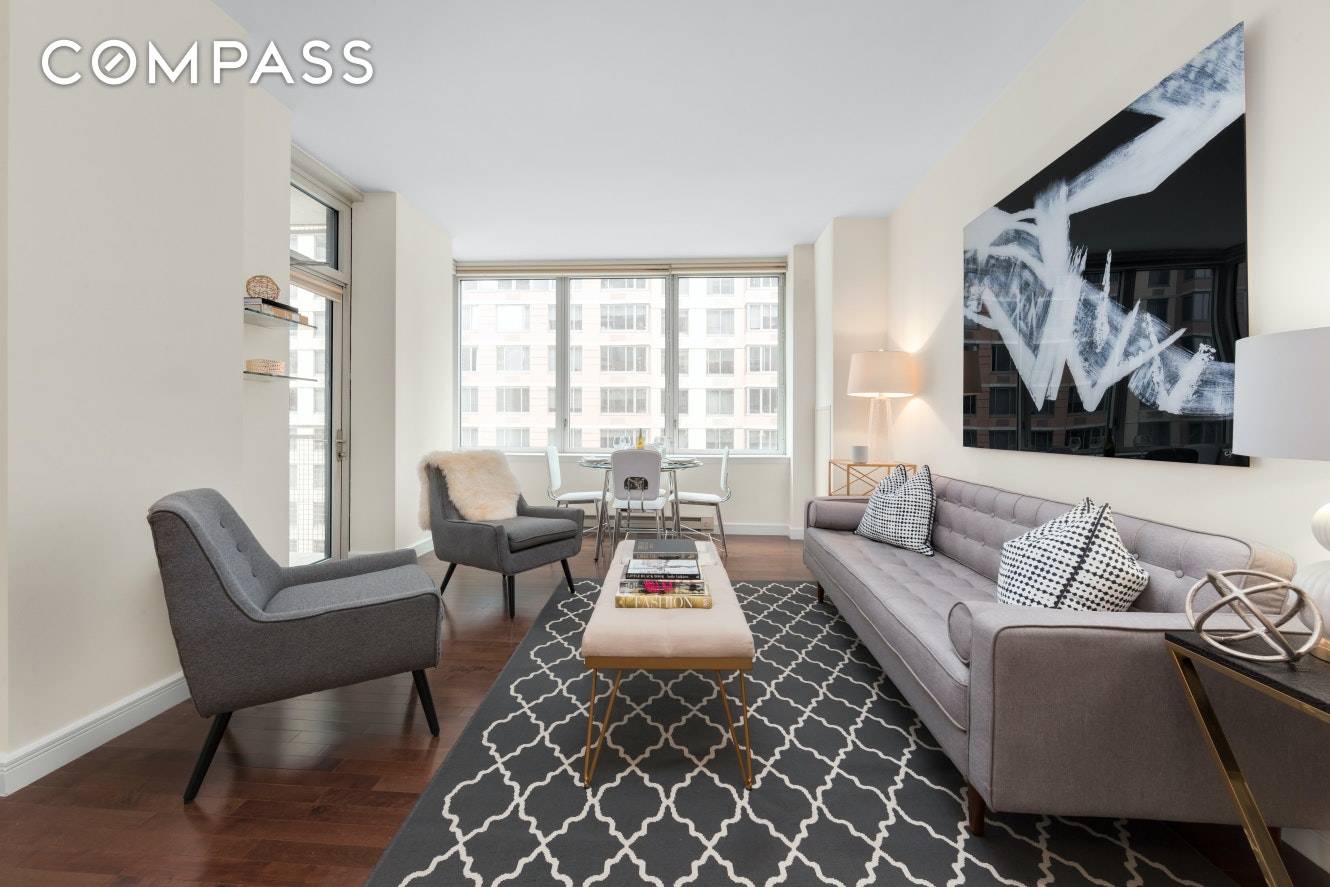 This South facing 2 bedroom features dark hardwood floors, 3 Zone Central Heat AC, Washer Dryer, a large open chef's kitchen with etched glass cabinetry, crystalline countertops, stainless steel appliances, ...