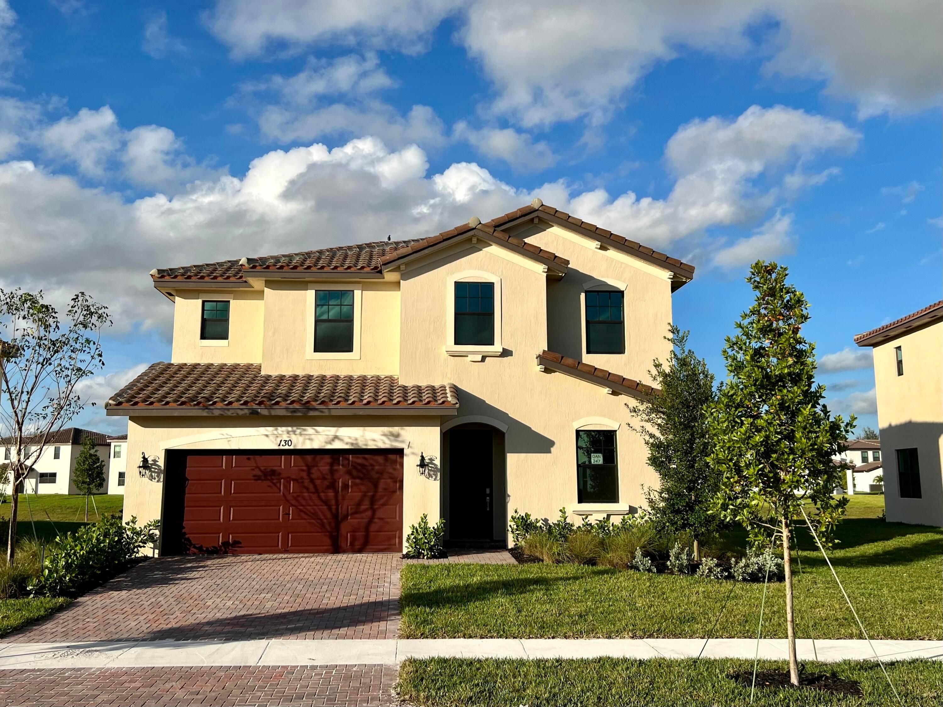 Lovely new home with impact windows, quartz countertops in kitchen and bath, smart home technology.