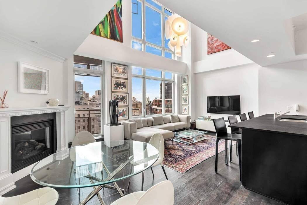 This spectacular, contemporary, light filled condo with soaring 20 foot ceilings, three bedrooms, and three bathrooms is located in the heart of Lenox Hill.