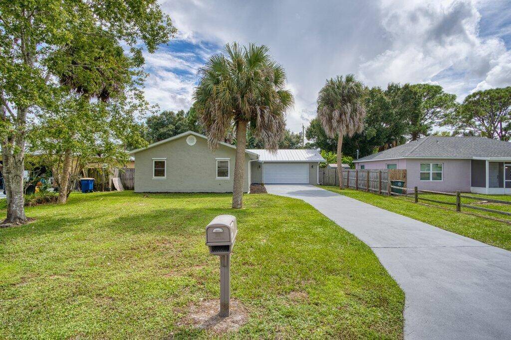 Renovated 3 bedroom, 2 bathroom home with 2 car garage and private backyard with lush landscaping.
