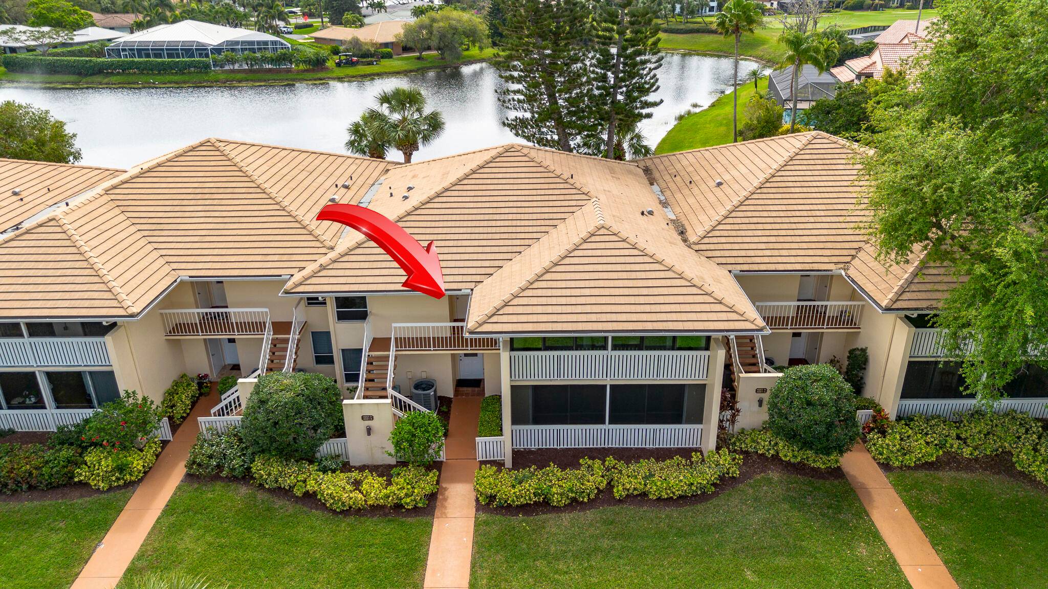 Immaculate 2nd floor three bedroom, two bathroom condo overlooking tranquil pond in Pipers Landing Yacht Country Club.