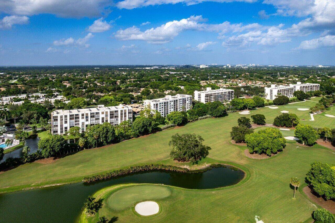 Beautifully renovated home with an amazing lake and golf view in Central Boca Raton.
