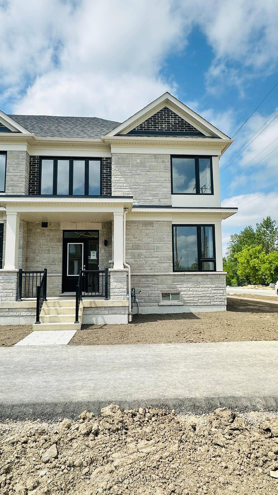 Brand new, sun filled end unit townhouse by Fernbrook Homes on a premium corner lot with a rare 2 car detached garage.