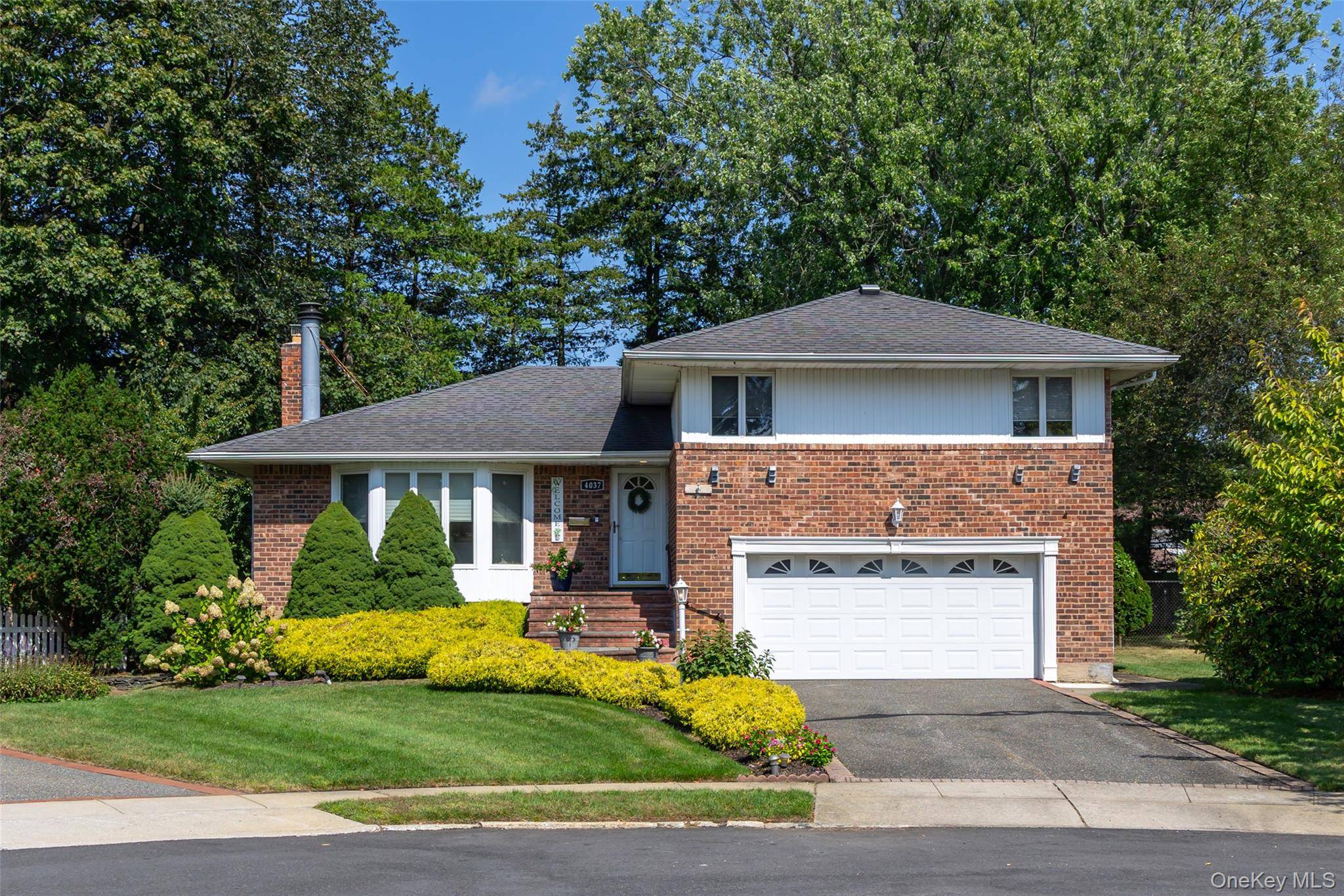 Cadillac split level home on an oversized lot at the end of a quiet cul de sac in the sought after Seaford Manor neighborhood !