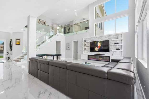 This stunning 5 bedroom, 4 bath lakefront home has been transformed with high end upgrades, sleek finishes, and smart features throughout.