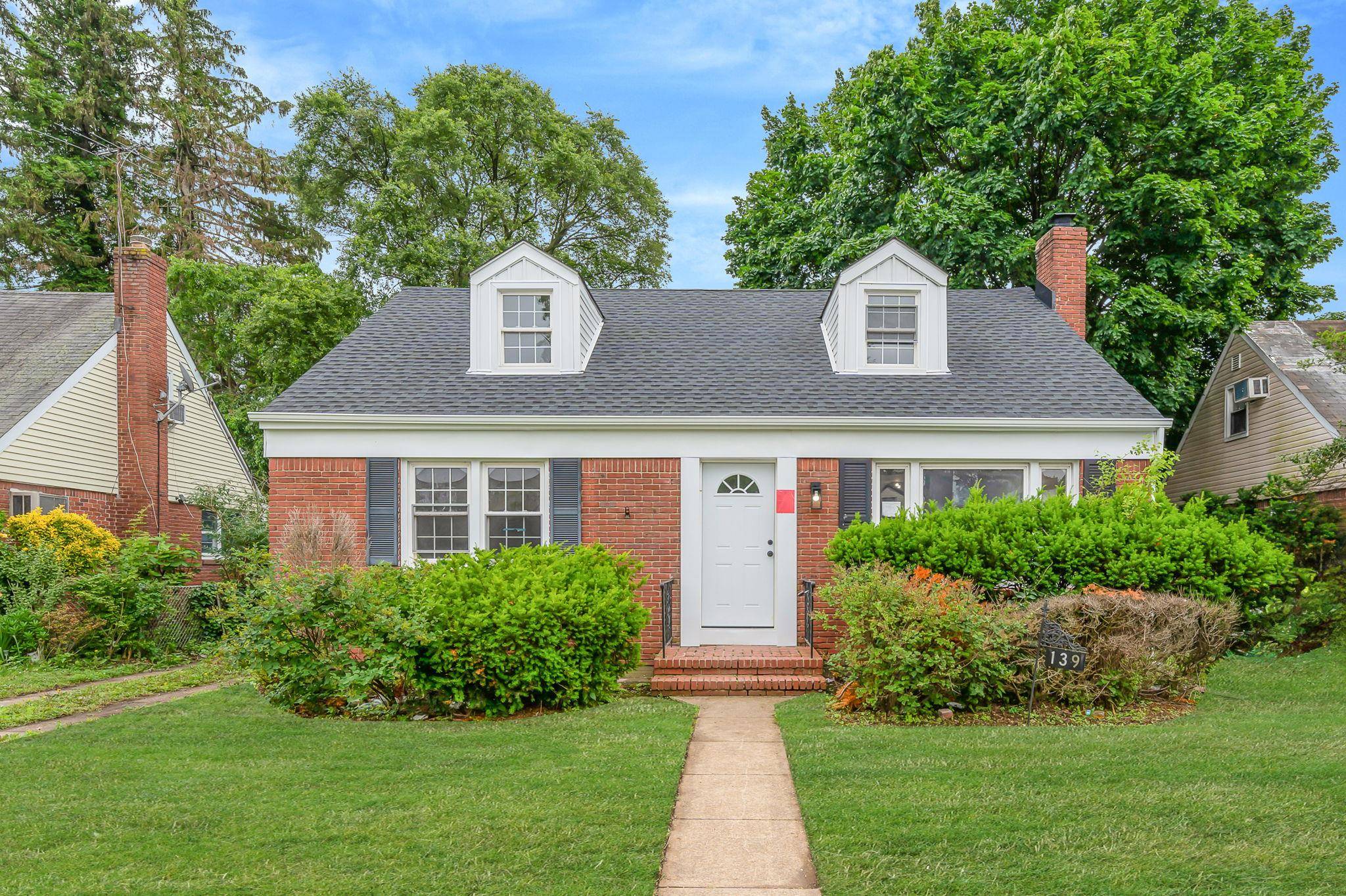 Step into timeless elegance at 139 Jean Ave, where a beautifully reimagined brick Cape Cod blends classic charm with refined updates.