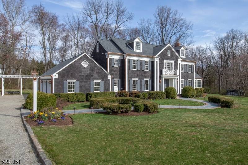 Stunningly remodeled in 2025 26, a gated Harding residence showcases an abundance of high end materials, finishes and updates.