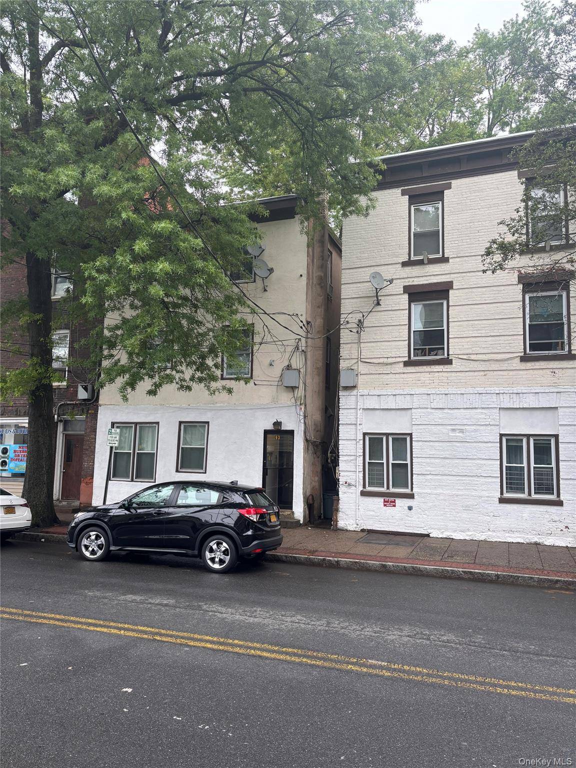 Investors, take note ! This three family property features three spacious one bedroom units, each equipped with its own gas boiler.