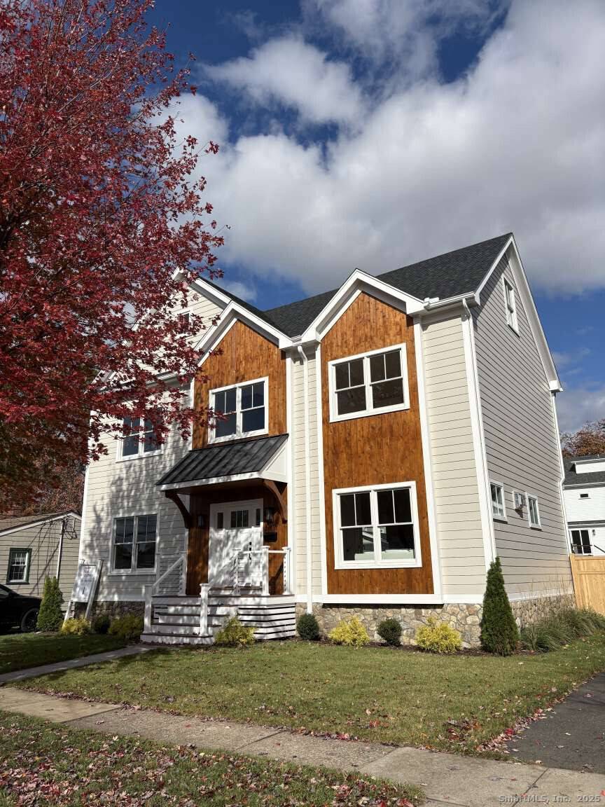 This new Construction exceptional coastal residence offers a rare blend of timeless design and modern finishes, just moments from the beach.