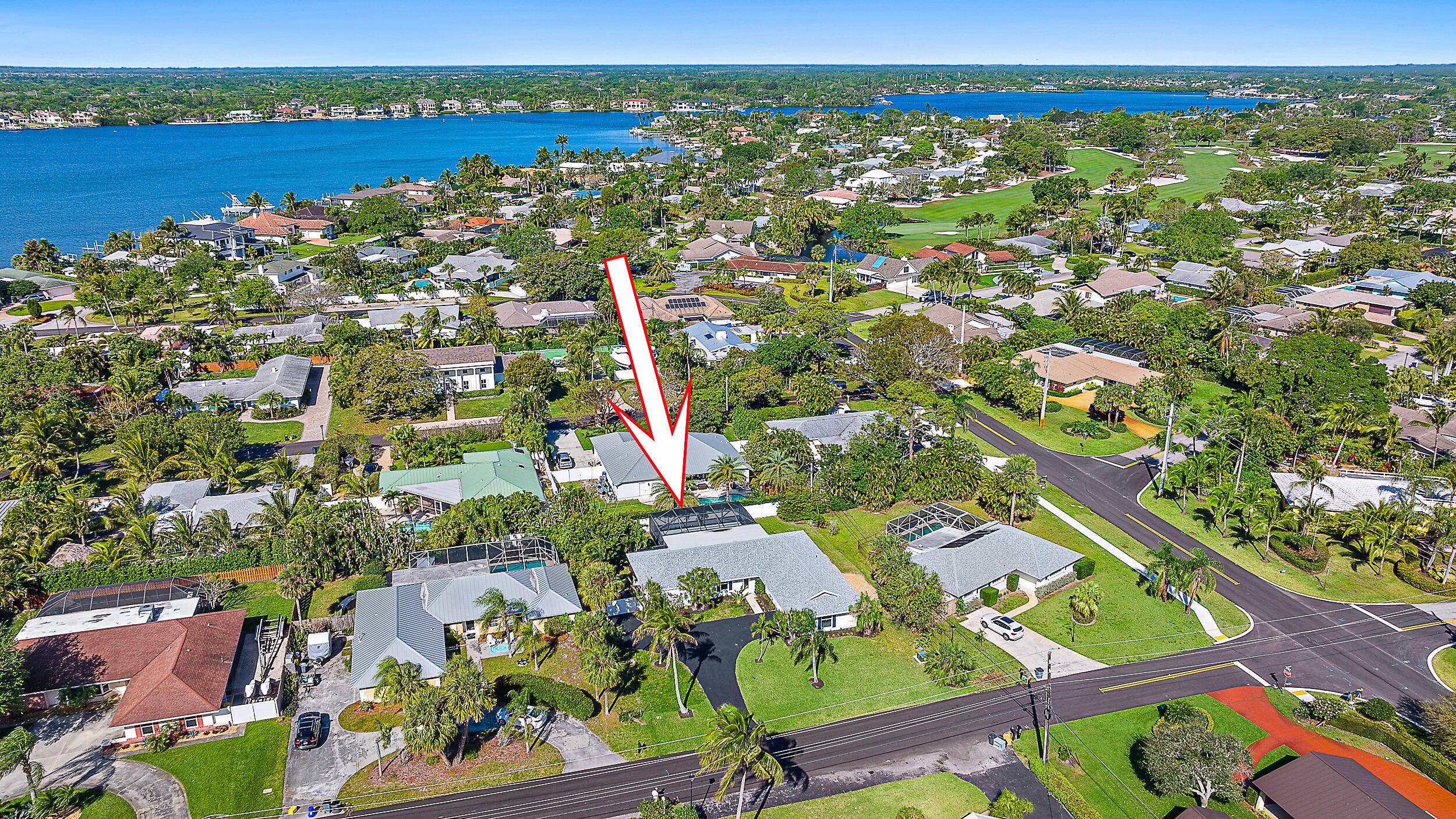 Nestled in the heart of Tequesta Country Club, this stunning, fully remodeled CBS home is truly one of a kind.