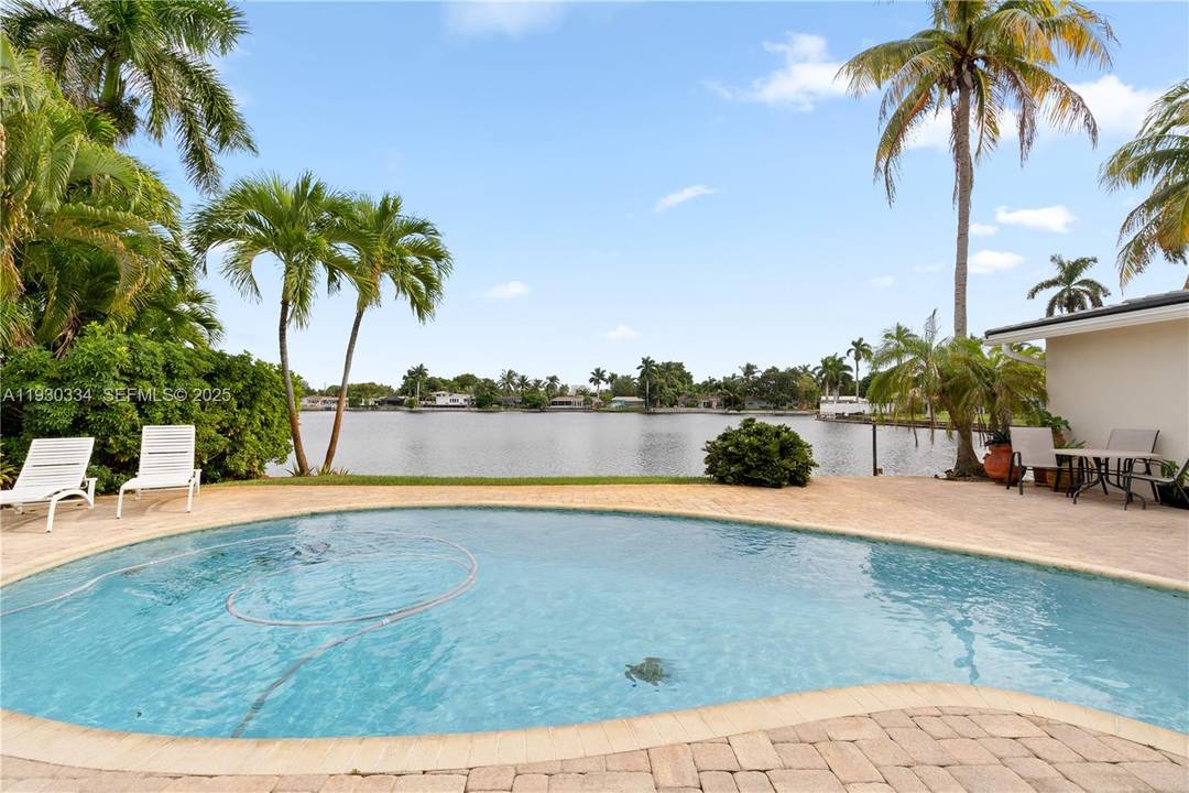 Resort style waterfront pool estate with no HOA, just 5 minutes to the beach, offering the ultimate Florida lifestyle.