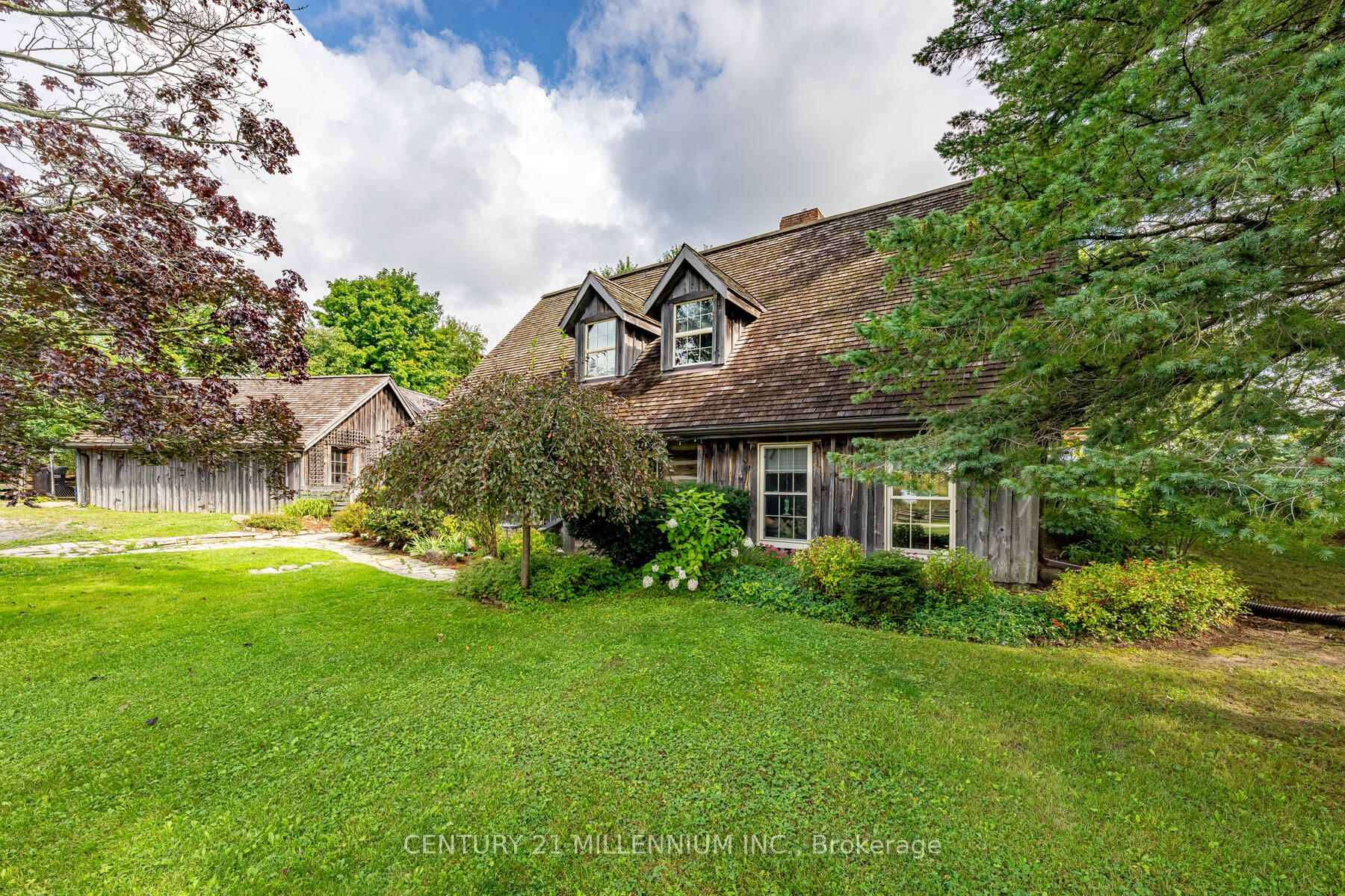 Welcome to this enchanting log home that perfectly blends rustic charm with modern comforts.