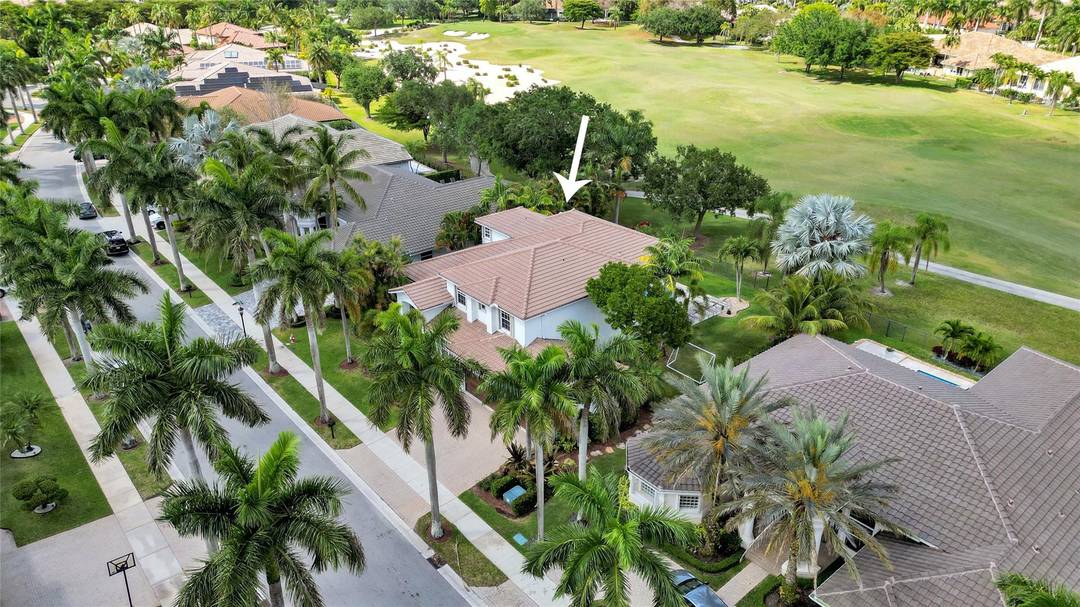 Commanding sweeping golf course views in the prestigious Weston Hills Country Club, this exceptional estate is perfectly positioned on an oversized lot with no rear neighbors, offering rare privacy and ...
