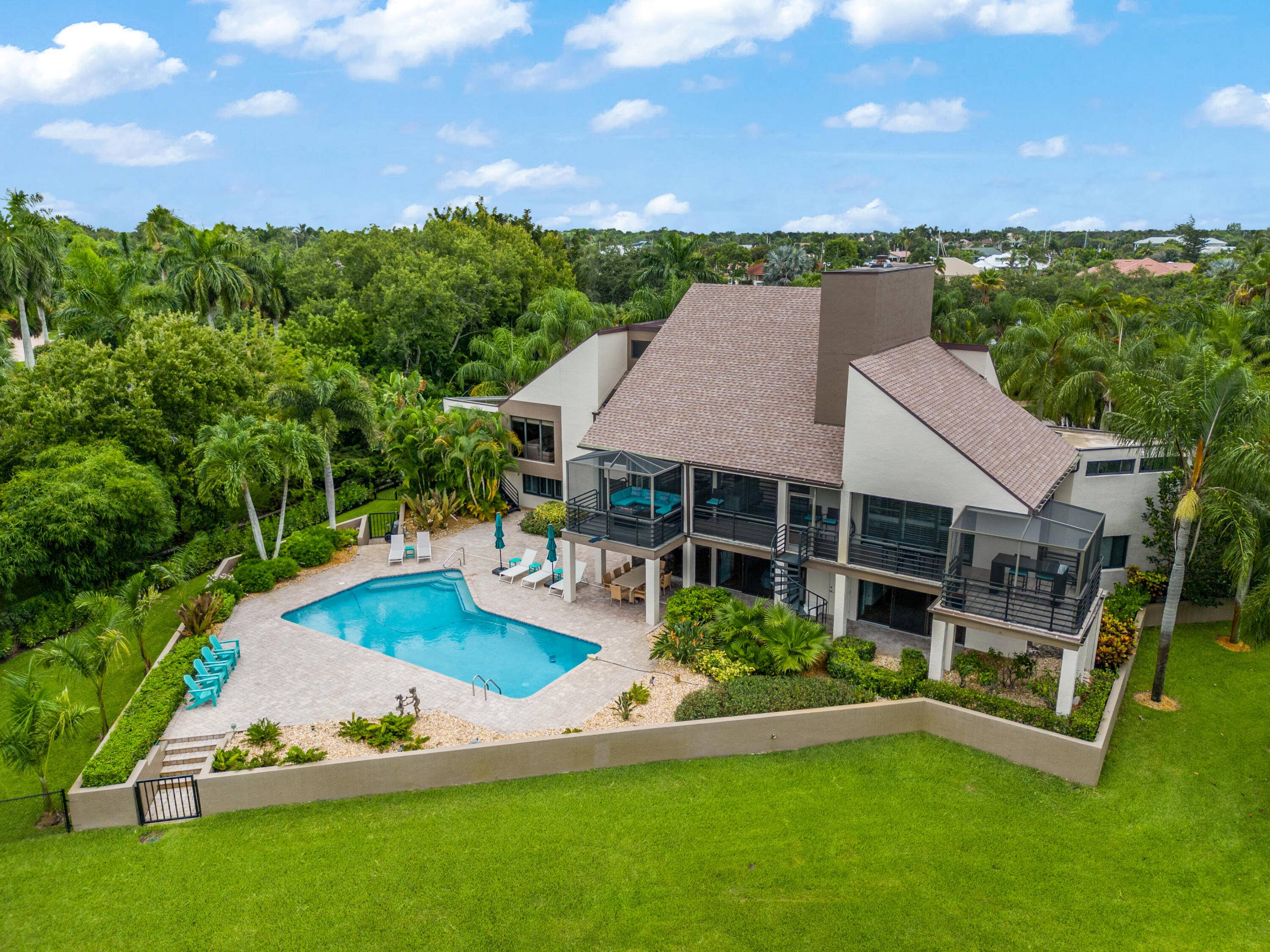 Take in the stunning waterfront views and mesmerizing sunsets from this spacious 5 bedroom possibly 6 bedroom, 4.