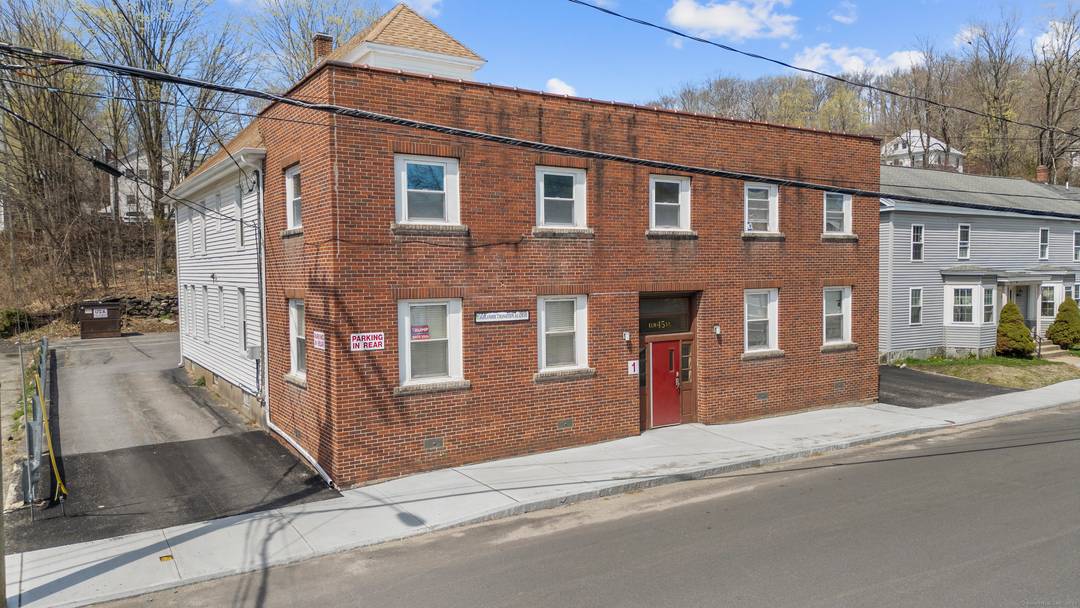 Unlock the potential of this solid 7 unit brick building, featuring a versatile mix of 5 residential apartments and 2 commercial office spaces.