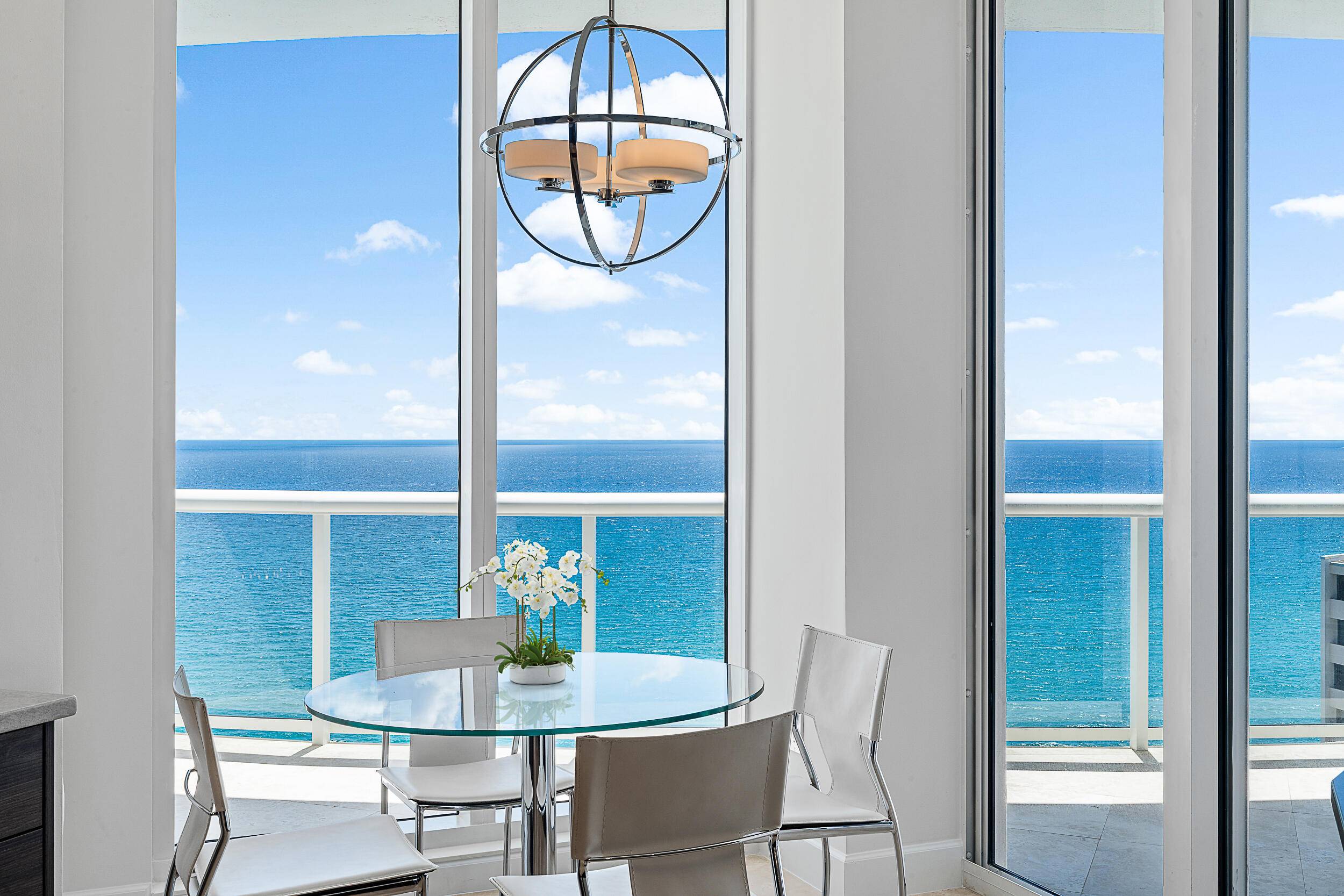 Renovated 3 bedroom, 3 bath condo with panoramic views of ocean and Intracoastal with floor to ceiling glass.