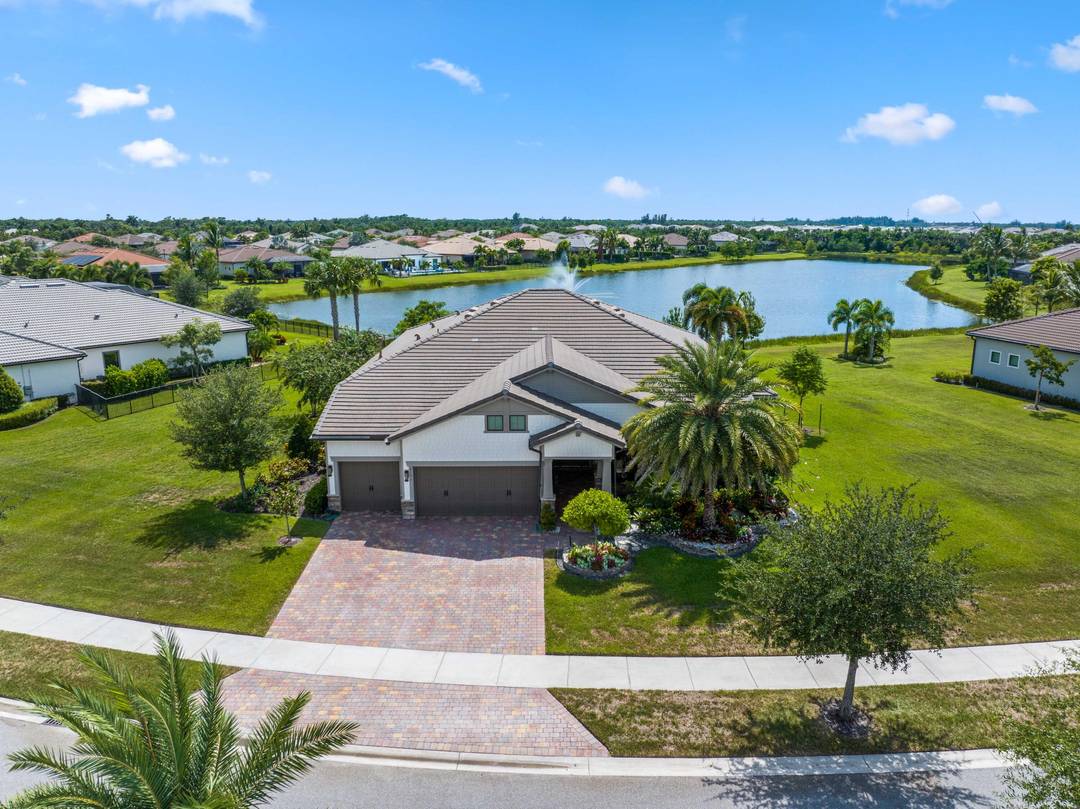 On one of the largest lots in Ancient Tree, this half acre lakefront home offers wide fountain views and a backyard built for enjoyment.
