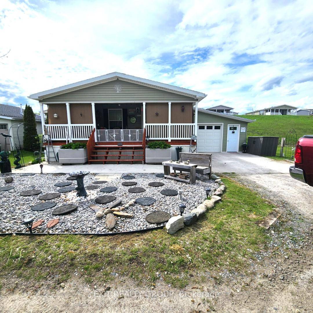 A charming bungalow nestled on Lakeside Drive, offering stunning views and an unparalleled sense of tranquility.