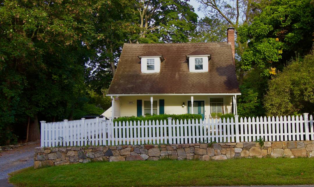 An inviting front porch welcomes you home to this light filled historic four bedroom cape within walking distance to the wonderful town of Westport.