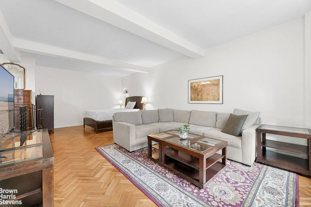 Extremely spacious, quiet and bright studio apartment with enormous living room and separate dining area presents the best of Manhattan living in a full time doorman building centrally located in ...