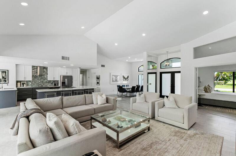 Pristine ''Brittany'' model with light filled, open two way split floor plan in gated Boca Woods CC.