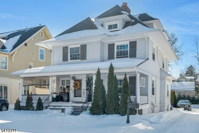 Beautifully renovated Montclair Colonial in the heart of the Historic District, featuring a custom gourmet kitchen open to the living room, a gorgeous dining room, and a powder room.