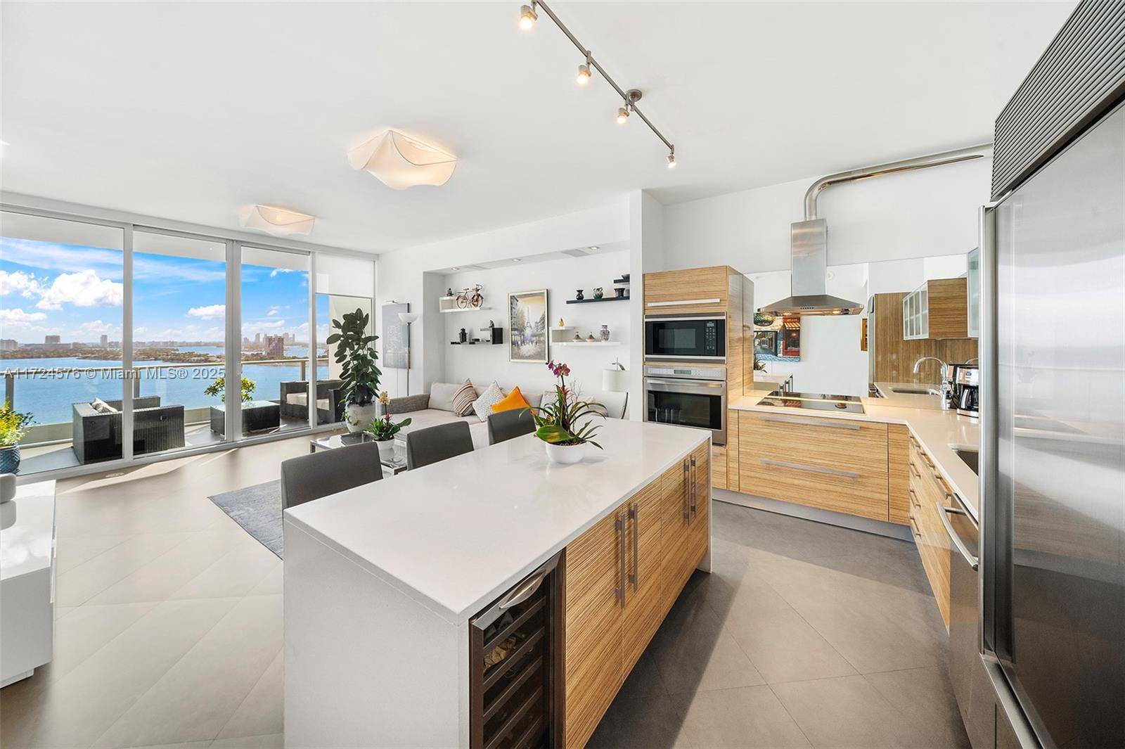 Live like royalty in this exquisite direct water view residence in highly desired Paramount Bay.