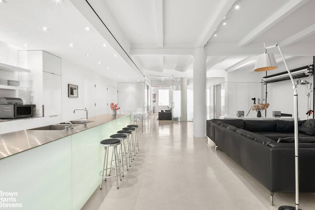 A private elevator opens directly into this full floor Chelsea loft, where scale, light, and separation come together with rare precision.