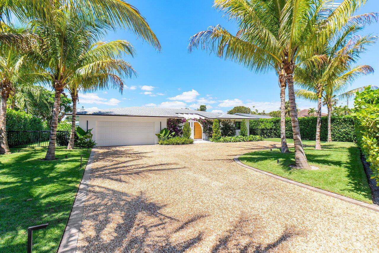 Welcome to this exquisitely renovated residence located in the highly desirable community of Lake Clarke Shores.
