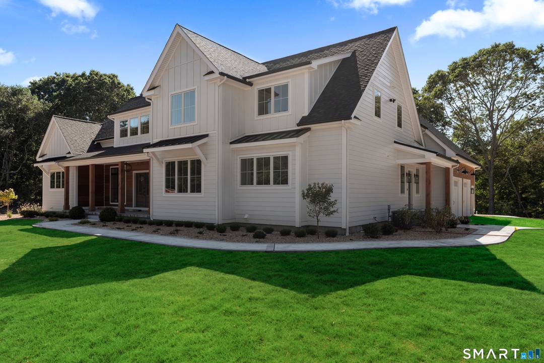 Situated on serene Pattagansett Lake, this to be built five bedroom, three bathroom home offers a luxurious and modern living experience.