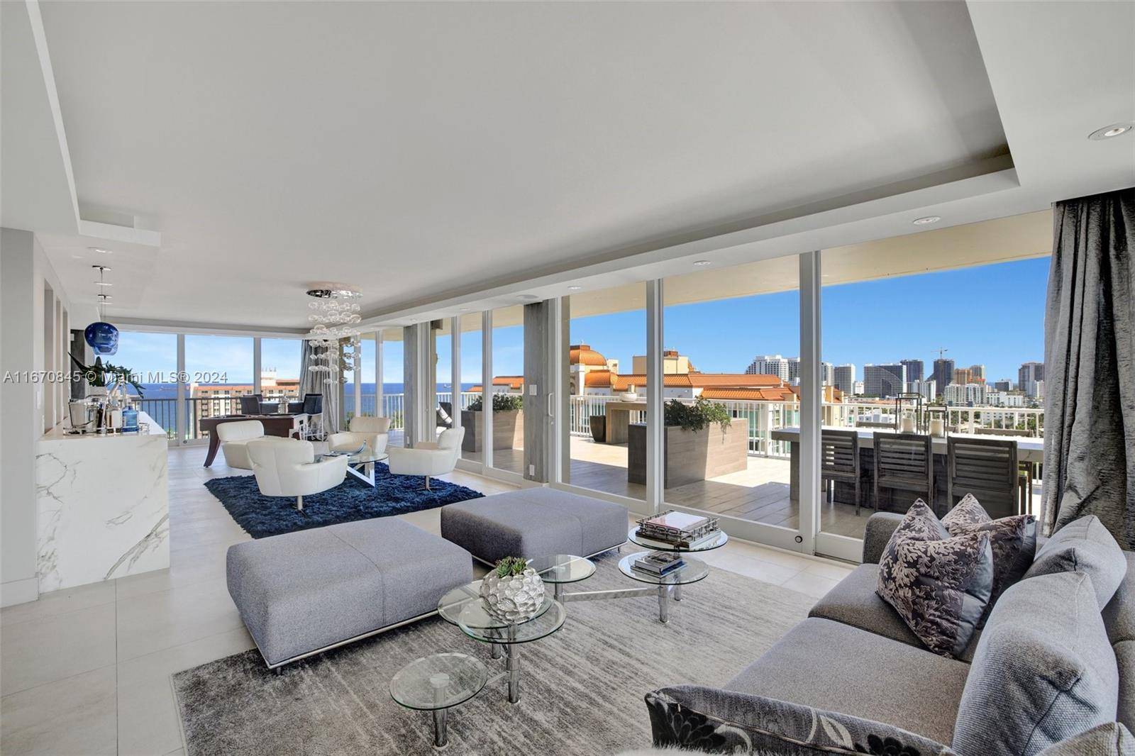 Penthouse G. A luxurious half floor, one of a kind sprawling home perched above it all offering breathtaking ocean, intracoastal and city views from every room.