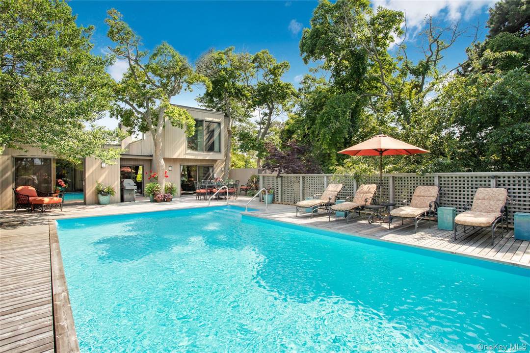 Unparalleled privacy in this triple mint 4 bedroom, 4 bath home with a meticulous attention to detail.