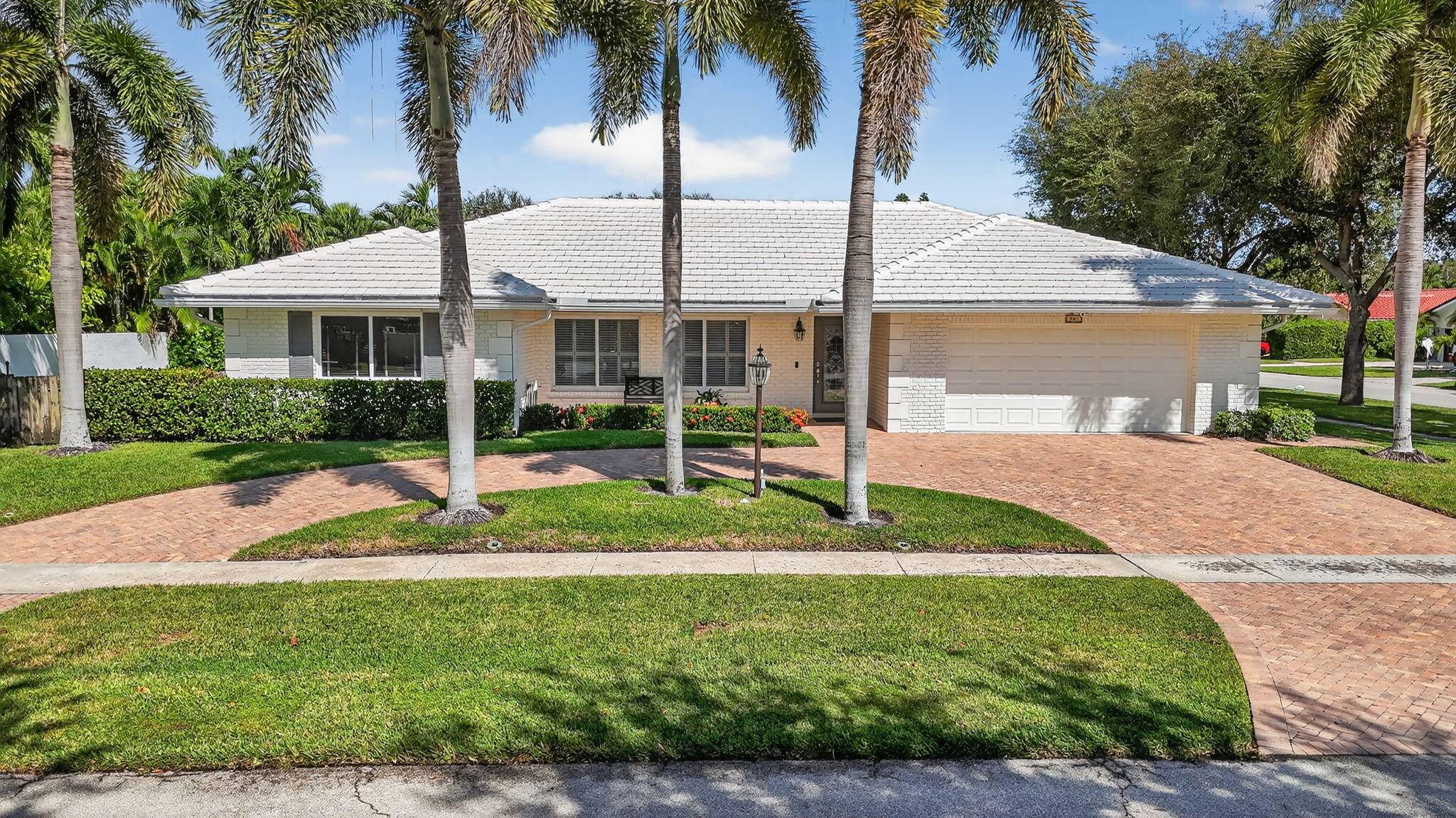 Offered by the original owners, this beautifully maintained Palm Beach Farms residence combines classic Boca Raton charm with thoughtful modern upgrades.