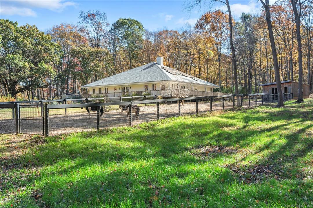 Astonishing, completely private and picturesque estate surrounded by mature forestry, majestic white pines, enchanting old stonewalls adorned with bountiful chartreuse and emerald ferns.