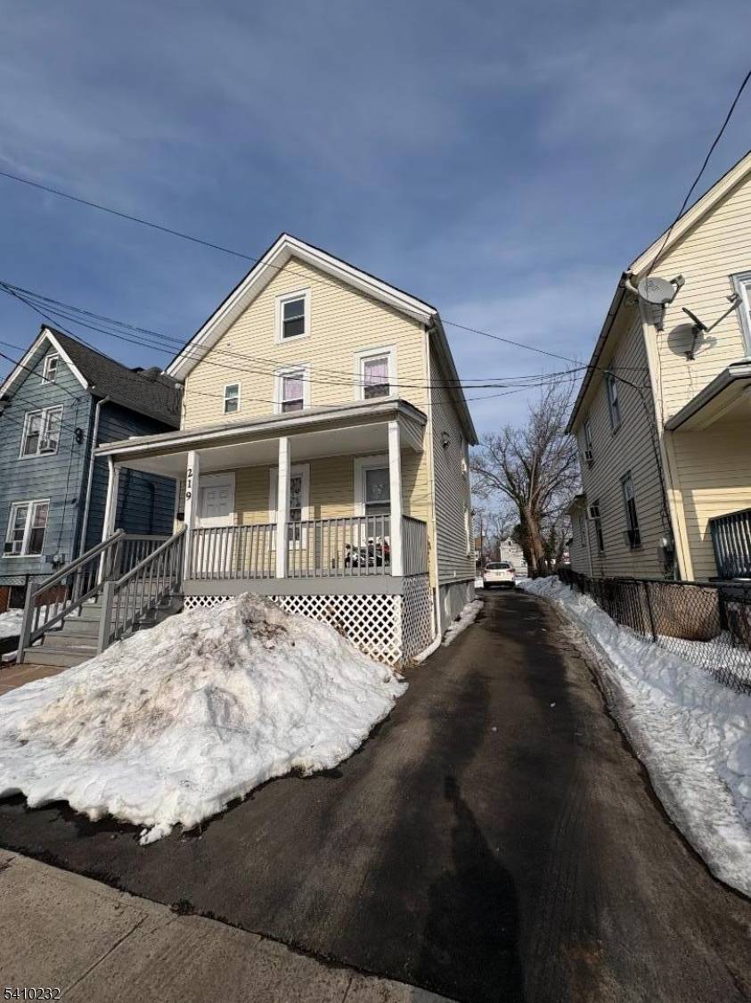 A charming front porch invites you into this beautiful home.