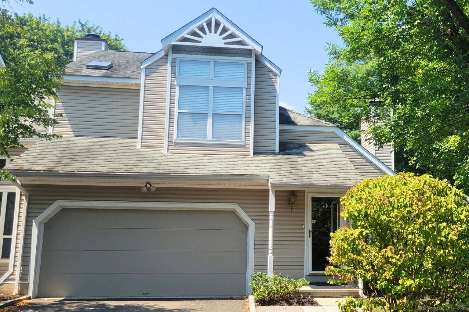Corner open floor townhouse with 2 car attached garage.