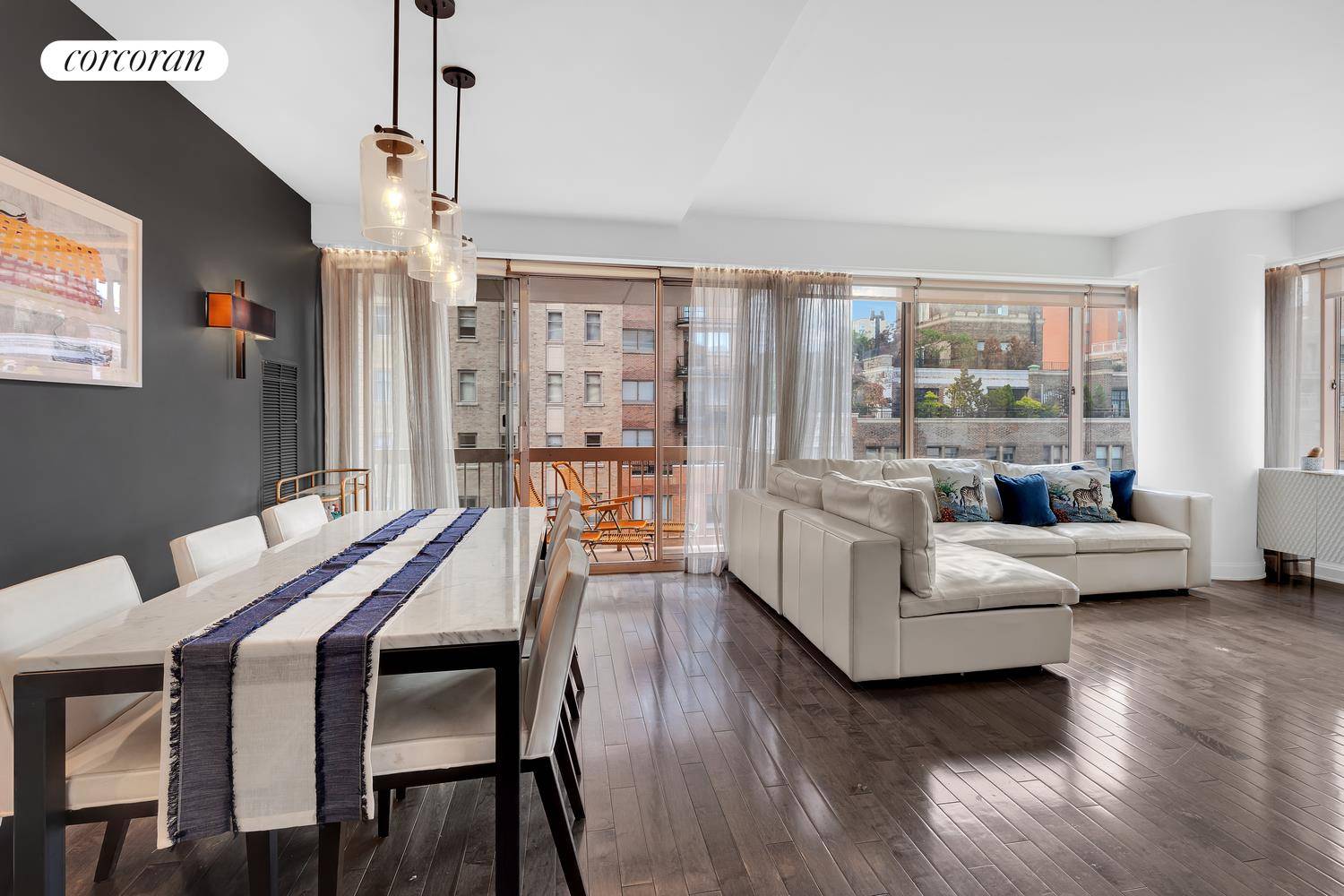 Open city views highlight this two bedroom, two bathroom apartment, framed by floor to ceiling windows.