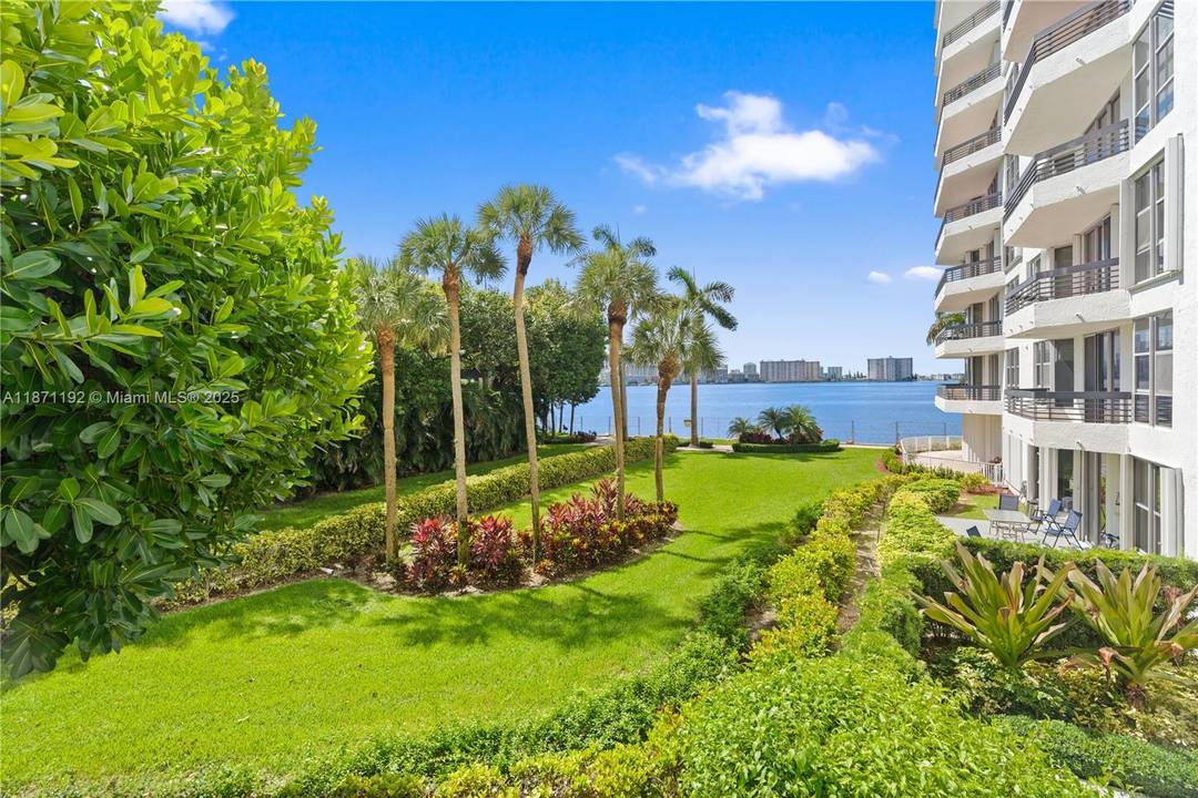 Wake up to stunning garden and Intracoastal views from this waterfront Aventura condo !