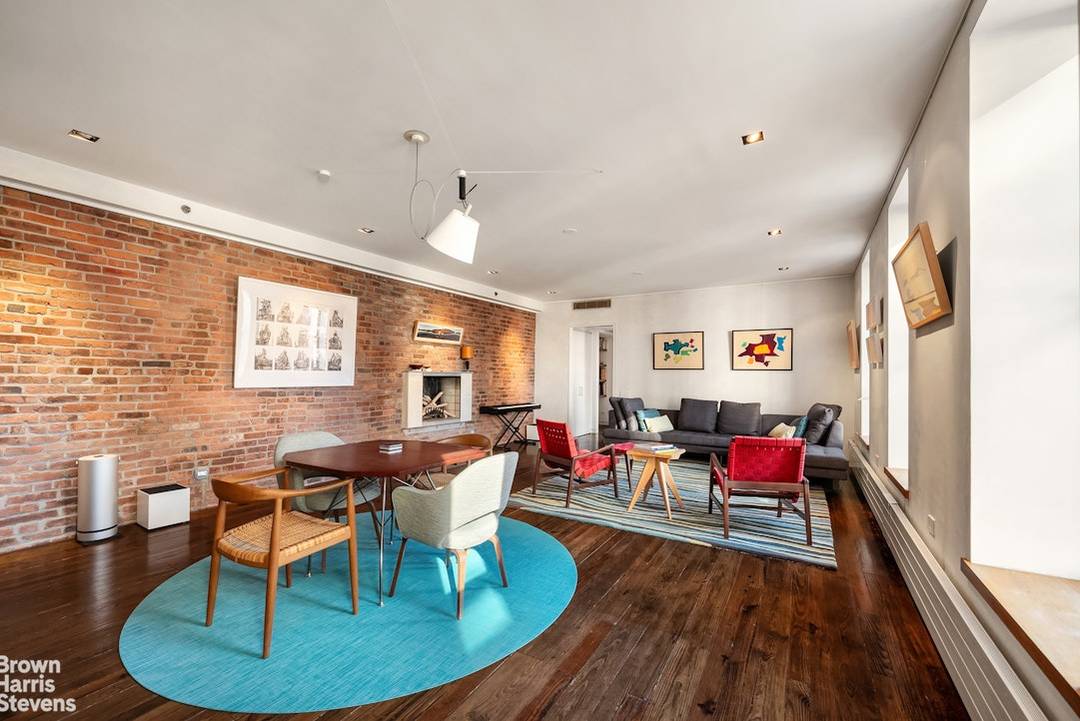 A rare find in the East Village Full floor loft in a boutique, pre war condo building, with key lock elevator, wood burning fireplace, and corner exposure with 17 windows ...
