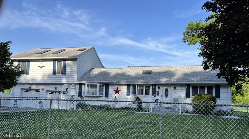 Move in ready expanded ranch featuring 3 spacious bedrooms and 2.