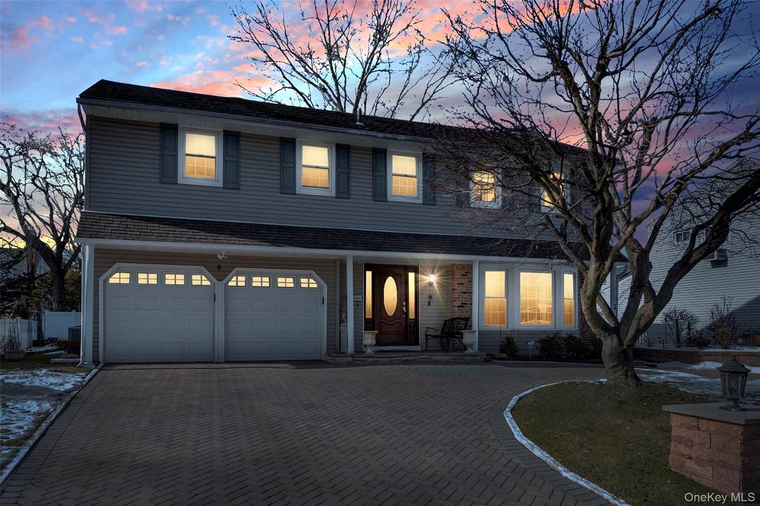 Center Hall Colonial in Prime Westbury Section, Eat in Kitchen with Stainless Steel Appliances, Laundry Room on main floor off the Kitchen, Den with wood burning fireplace, Formal Living Room, ...